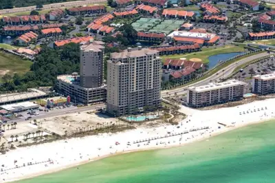 an aerial view of a beach with buildings and the ocean at Sandy Feet Retreat 3 bed 3 bath in Panama City Beach