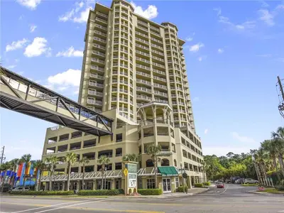 a tall white building with a street in front of it at Blue Haven Escape, 2 Bed 2 Bath in Panama City Beach