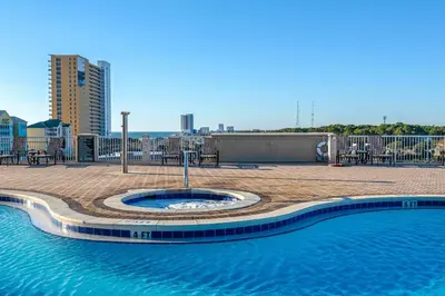 a swimming pool on the roof of a building at Blue Haven Escape, 2 Bed 2 Bath in Panama City Beach