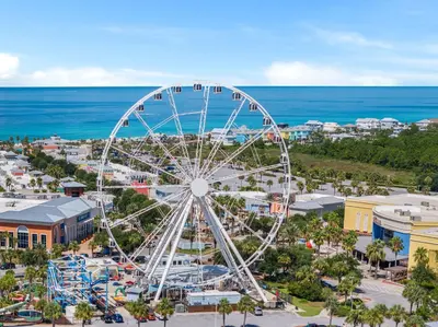 an amusement park with a ferris wheel and the ocean at Pet Friendly Beach House - Tropic Like It's Hot in Panama City Beach