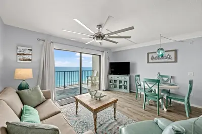 a living room with a couch and a table at The Summit - Family Friendly Vacation! in Panama City Beach