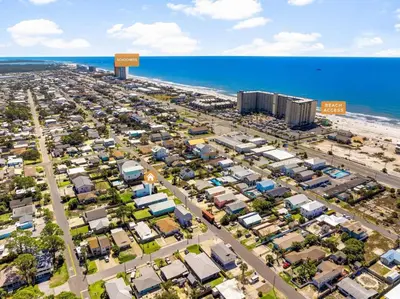 an aerial view of a parking lot next to the beach at Sunset Nirvana in Panama City Beach