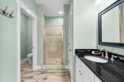 a bathroom with a sink and a shower at Sunset Nirvana in Panama City Beach