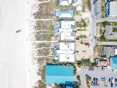 an aerial view of a beach with houses at Emerald Seascape! Gulf front! Dog friendly! in Panama City Beach