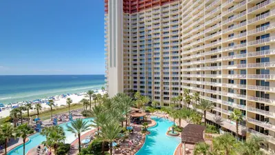 an aerial view of a resort with a pool and the beach at Looking for a Shore Thing? Here it is! 2BR 25BA Sleeps 8! Beachfront! in Panama City Beach