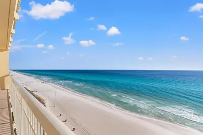 a view of the beach from a balcony at Splash, Relax & Repeat at Dolphin View Retreat! Beachfront! Sleeps 9! in Panama City Beach