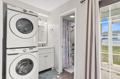 a laundry room with a washer and dryer at Come enjoy some Seawaves! 2BR 25BA Sleeps 8! Coastal Townhome w/Beachview! in Panama City Beach