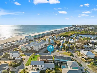 an aerial view of a resort next to the beach at Stay at The Salty Palm! 2BR 15BA Sleeps 7 in Panama City Beach