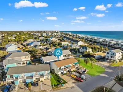 an aerial view of a resort with the ocean at Stay at The Salty Palm! 2BR 15BA Sleeps 7 in Panama City Beach