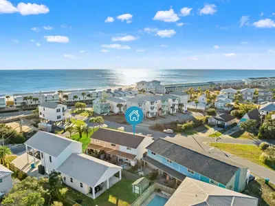 an aerial view of a resort with the ocean at Stay at The Salty Palm! 2BR 15BA Sleeps 7 in Panama City Beach