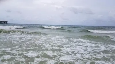 a large body of water with waves in the ocean at Seas the Day! Your Perfect 2BR Beachfront Escape! Sleeps 8! in Panama City Beach
