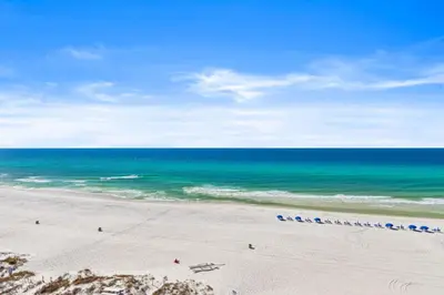 an aerial view of a beach with the ocean at Beachfront! Balcony Views! Pools and Beach Access in Panama City Beach