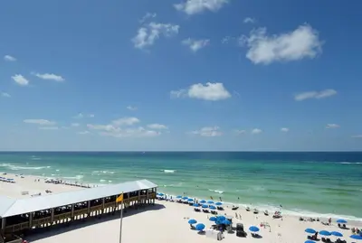 a view of a beach with umbrellas and the ocean at Shores of Panama 530 in Panama City Beach