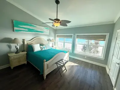 a bedroom with a bed and a ceiling fan at Gulfs Edge Townhome #16 - Sealee by Emerald Coast Retreats in Panama City Beach