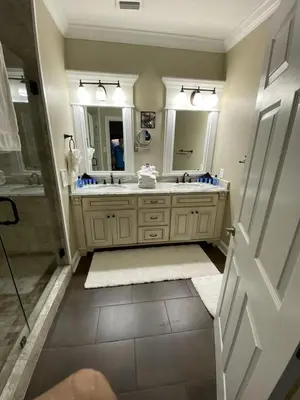 a bathroom with a sink and a shower and a mirror at Gulfs Edge Townhome #16 - Sealee by Emerald Coast Retreats in Panama City Beach