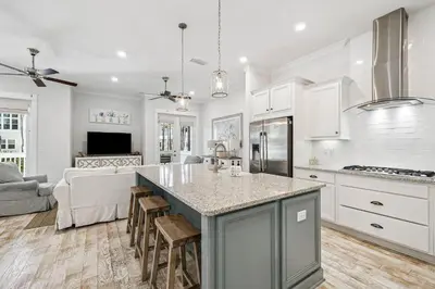 a kitchen with a large island in the middle of a room at TL SEA 88 Pine Lands Loop W Unit A in Inlet Beach