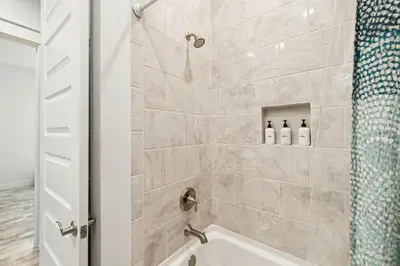 a bathroom with a shower with two bottles of soap at TL SEA 88 Pine Lands Loop W Unit A in Inlet Beach