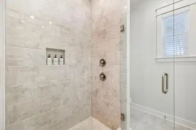 a bathroom with a shower with a glass door at TL SEA 88 Pine Lands Loop W Unit A in Inlet Beach