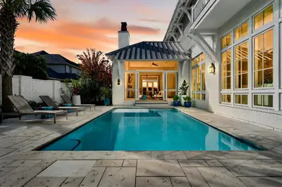 a swimming pool in the backyard of a house at BAH Casa in Inlet Beach