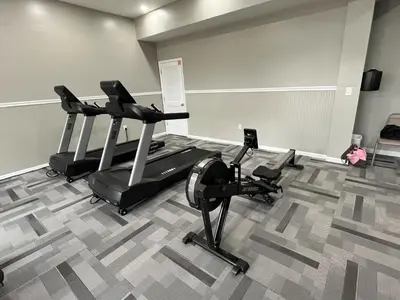 a gym with two treadmills and two exercise bikes at Horizon South 59-202 in Panama City Beach
