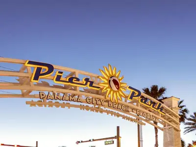 a sign for a pajama city beach break sign at Tiki Tango Hideaway in Panama City Beach