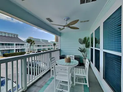 a patio with a table and chairs on a balcony at Southwind I Condo #K8 in Panama City Beach
