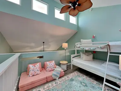a room with two bunk beds and a ceiling at Southwind I Condo #K8 in Panama City Beach