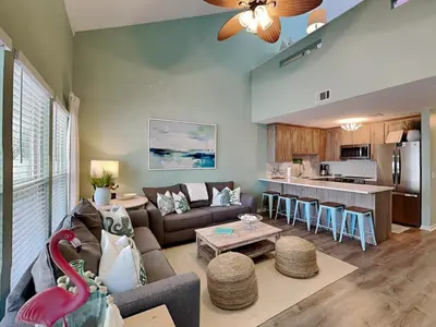 a living room with a couch and a table at Southwind I Condo #K8 in Panama City Beach
