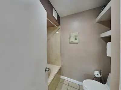 a bathroom with a toilet and a shower at Edgewater Villa #1902 in Panama City Beach