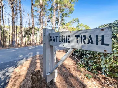 a sign for a nature trail on the side of a road at Cassine Gardens #101 in Seagrove Beach