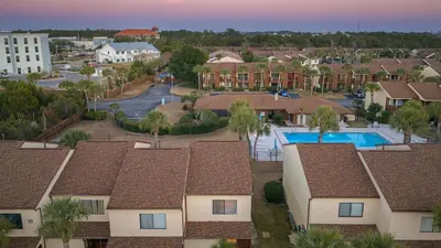 an aerial view of a residential neighborhood with houses at Sandbar Serenade by AvantStay Beachside Home Pool Tennis Court Beach Access Near Pier Park in Panama City Beach