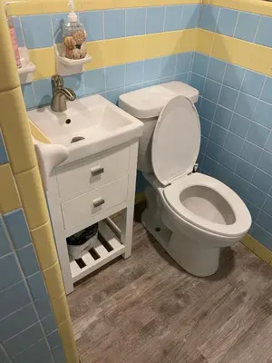 a bathroom with a toilet and a sink at Tiny home living!! First floor condo! in Panama City Beach