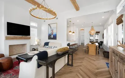 a living room with a couch and a fireplace at 30A Stars and Stripes in Seagrove Beach