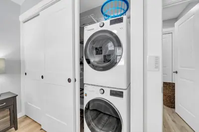 a laundry room with a washer and dryer at Pelican's Roost in Santa Rosa Beach