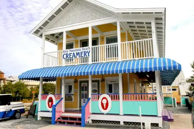 a building with a captain america sign on it at Pelican's Roost in Santa Rosa Beach