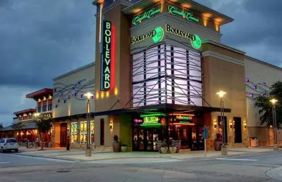 a large building with neon signs on the side of it at Pelican's Roost in Santa Rosa Beach