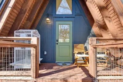 a front door of a blue house with a green door at Near Hiking! Angler Oasis with Hot Tub in Florida