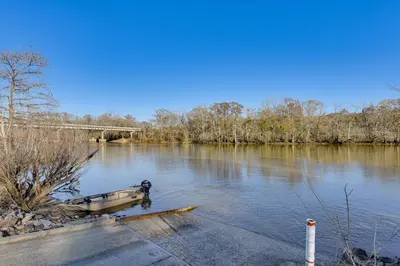a boat sitting in the middle of a river at Near Hiking! Angler Oasis with Hot Tub in Florida
