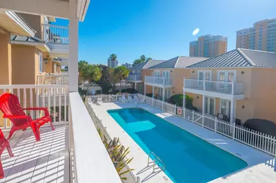 a view from the balcony of a apartment with a swimming pool at Beach Getaway for 15 A Few Steps from the Sand in Panama City Beach