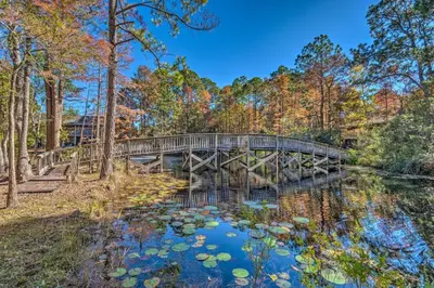 a bridge over a pond with lily pads at 30As Favorite Beach Condo- 6 min walk to the beach in Santa Rosa Beach