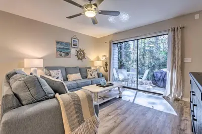 a living room with a couch and a table at 30As Favorite Beach Condo- 6 min walk to the beach in Santa Rosa Beach