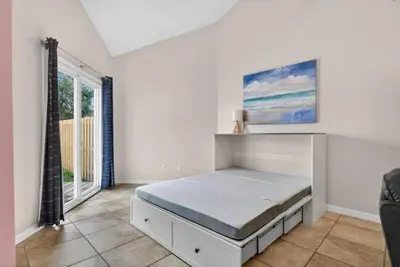 a bedroom with a bed and a window at Emerald Escape 1 - 3 Blocks to Beach in Panama City Beach