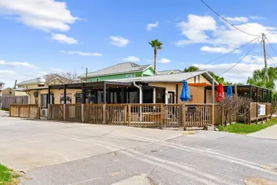 a house with a wooden fence in front of it at Emerald Escape 1 - 3 Blocks to Beach in Panama City Beach