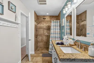 a bathroom with a sink and a shower at Emerald Escape 2 - 3 Blocks to Beach in Panama City Beach