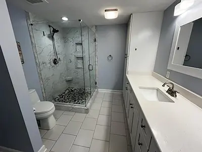 a bathroom with a shower and a toilet and a sink at Seychelles 701 by Emerald Coast Retreats in Panama City Beach