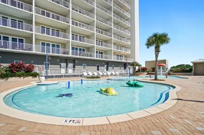 a swimming pool in front of a building at Laketown Wharf Beach Resort in Panama City Beach