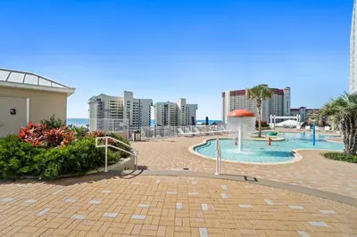 a resort with a swimming pool and a beach at Laketown Wharf Beach Resort in Panama City Beach