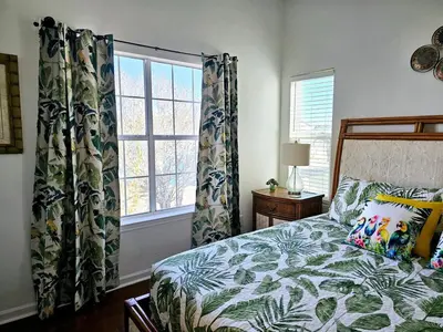 a bedroom with a bed and a window at You, Me & the Sea! in Panama City Beach