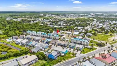 an aerial view of a city with buildings and a road at You, Me & the Sea! in Panama City Beach