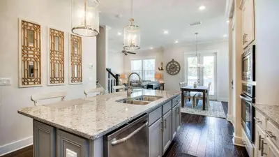 a kitchen with a sink and a counter top at Prominence 14B in Rosemary Beach